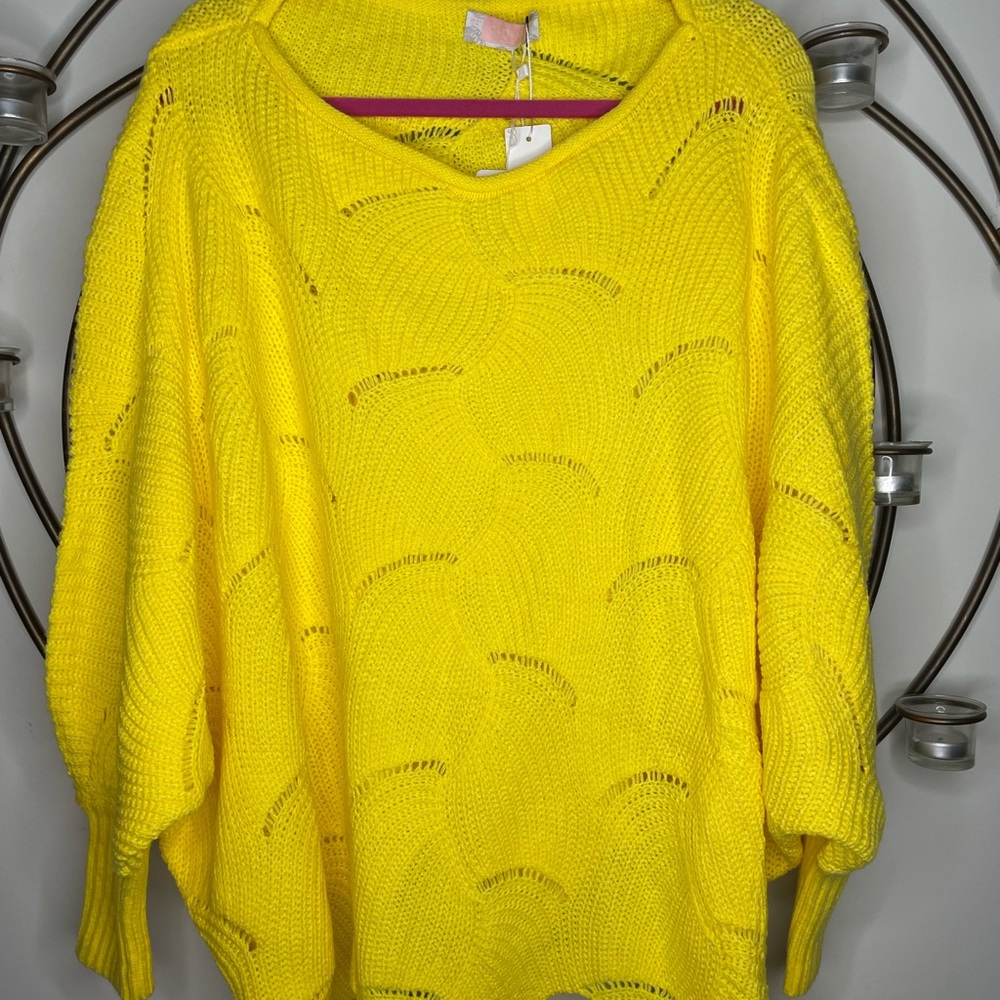 Oversized woman’s sweater. Can be worn off one shoulder.